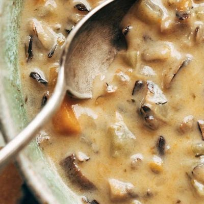 Instant Pot Wild Rice soup in bowl with spoon.