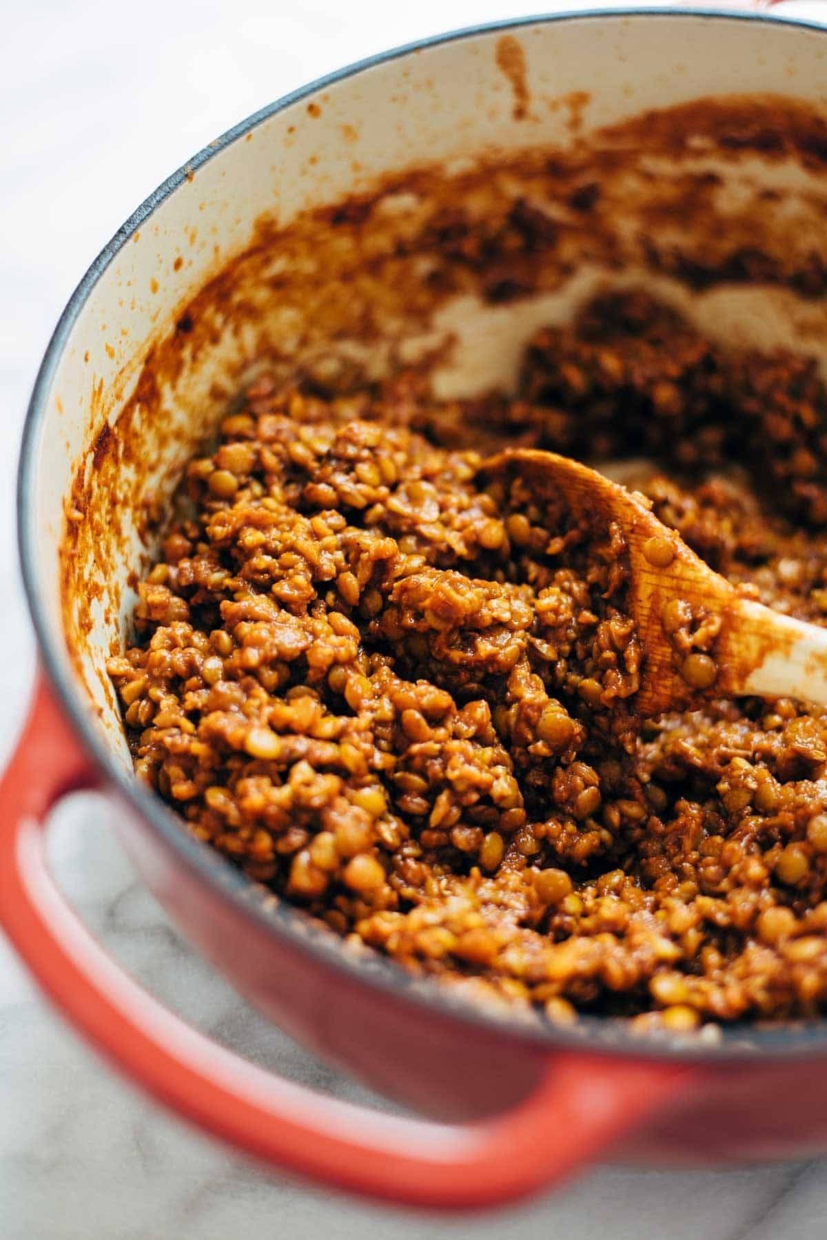 Spicy Lentil Nachos with Three Cheese Sauce - you will not believe how good these are! Saucy filling with a velvety homemade cheese sauce. Vegetarian. | pinchofyum.com