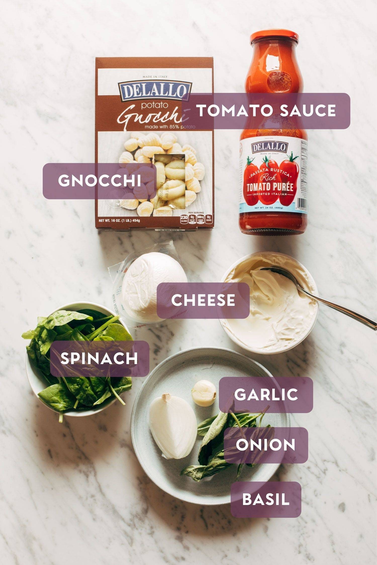 Ingredients for three cheese baked gnocchi. There's purple text over the top that says the name of each ingredient.